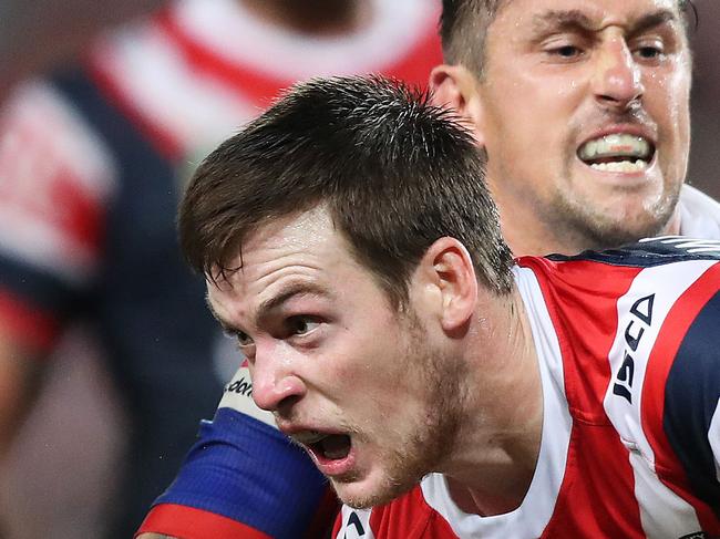 Newcastle's Mitchell Pearce tackles Roosters Luke Keary during the Sydney Roosters v Newcastle Knights rugby league match at Allianz Stadium, Sydney. Picture: Brett Costello