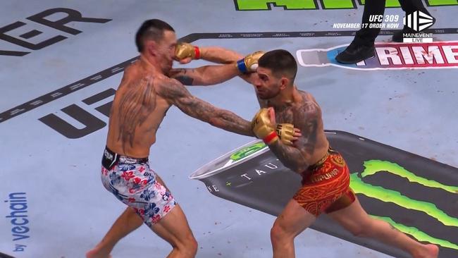 Ilia Topruia connects with a brutal punch on Max Holloway. Photo: Main Event.