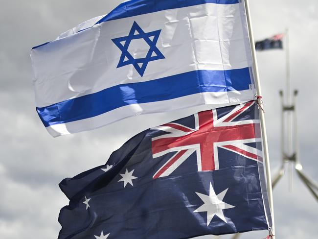 CANBERRA, Australia - NewsWire Photos - October 7, 2024: Thousands of attendees gather at Parliament House in Canberra taking an historic stand against antisemitism and to stand in support of Israel.  Picture: NewsWire / Martin Ollman