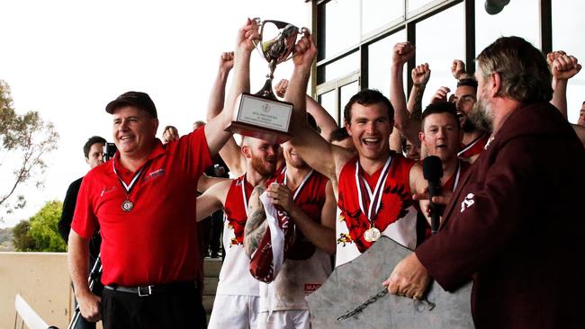 Flagstaff Hill coach Rod Mitchell and captain Michael Shearer accepting the premiership trophy from Southern Football League president Craig Warman at Hickinbotham Oval. Picture: Matt Loxton.