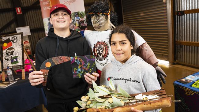 Jett Silcox and Mayalii Gordon with a figure of the warrior Multuggerah at the Toowoomba NAIDOC Week celebrations at The Goods Shed, Monday, July 4, 2022. Picture: Kevin Farmer