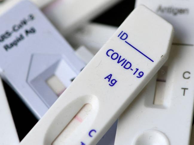 An illustration shows used Corona rapid tests with negative results in Dortmund, western Germany on January 20, 2022, during the ongoing coronavirus (Covid-19) pandemic. - Like in other European countries, the number of daily new coronavirus infections is rising, as the Omicron variant sparked a renewed surge in transmissions. (Photo by Ina FASSBENDER / AFP)