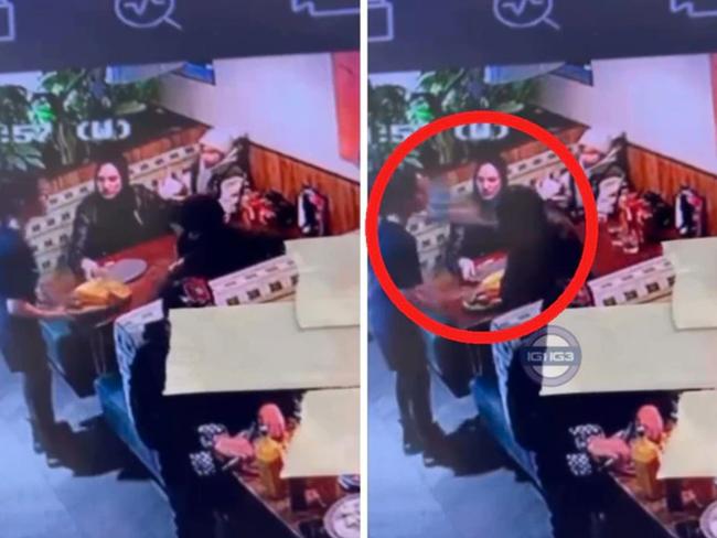 Police have arrested a man after a viral video showing a waitress being slapped with a plate.