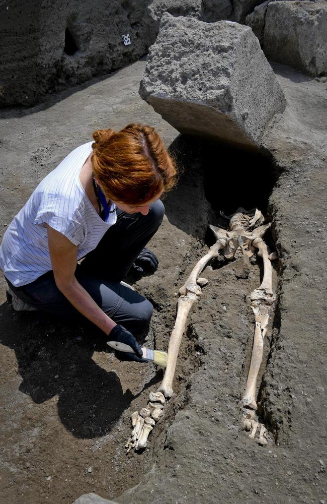 Anthropologist Valeria Amoretti carefully uncovers the skeleton of a victim of the eruption of Mt. Vesuvius in A.D. 79, which destroyed the ancient town of Pompeii. Picture: Ciro Fusco/ANSA via AP