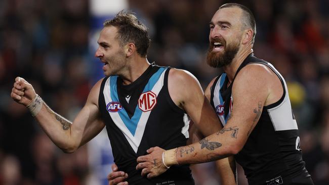 MELBOURNE , AUSTRALIA. April 5, 2024. AFL Gather Round. Round 4. Port Adelaide vs Essendon at the Adelaide Oval. Jeremy Finlayson of the Power celebrates a 4th quarter goal with Charlie Dixon . Pic: Michael Klein