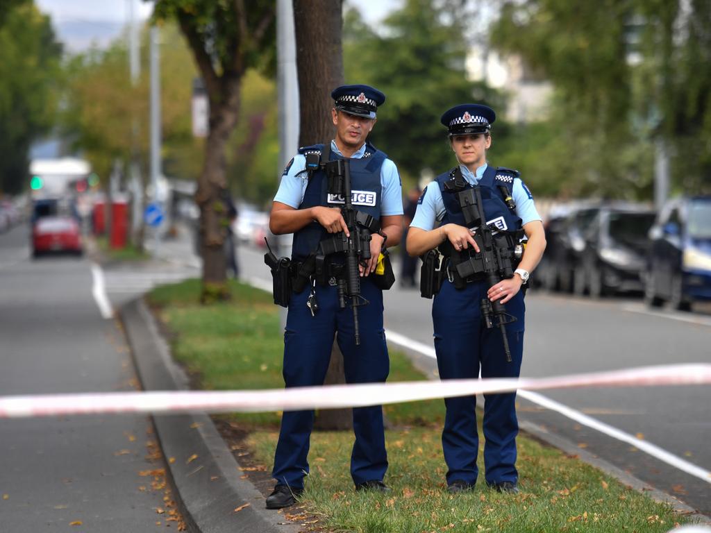 Armed police officers patrol near the Al Noor Masjid on Deans Rd in Christchurch. Picture: AAP