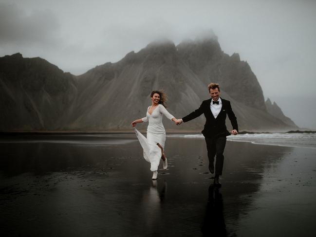 James Frost from James Frost Photography photographed this couple running towards the camera while holding hands in Eastern Iceland.