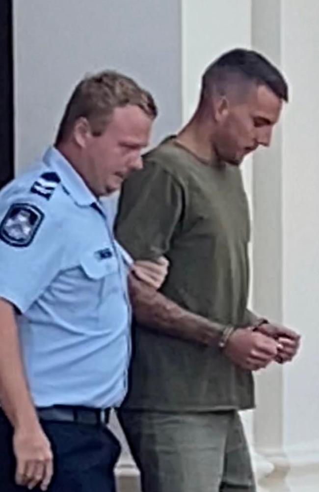 Liam Jye Kirstenfeldt, escorted by a police officer, leaving Gympie District Court on January 30, 2023.