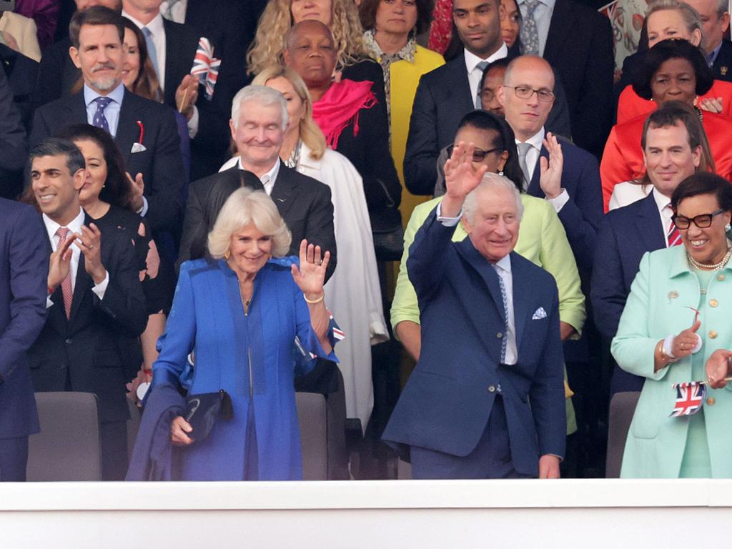 The newly-crowned King and Queen wave to the crowd. Picture: AFP