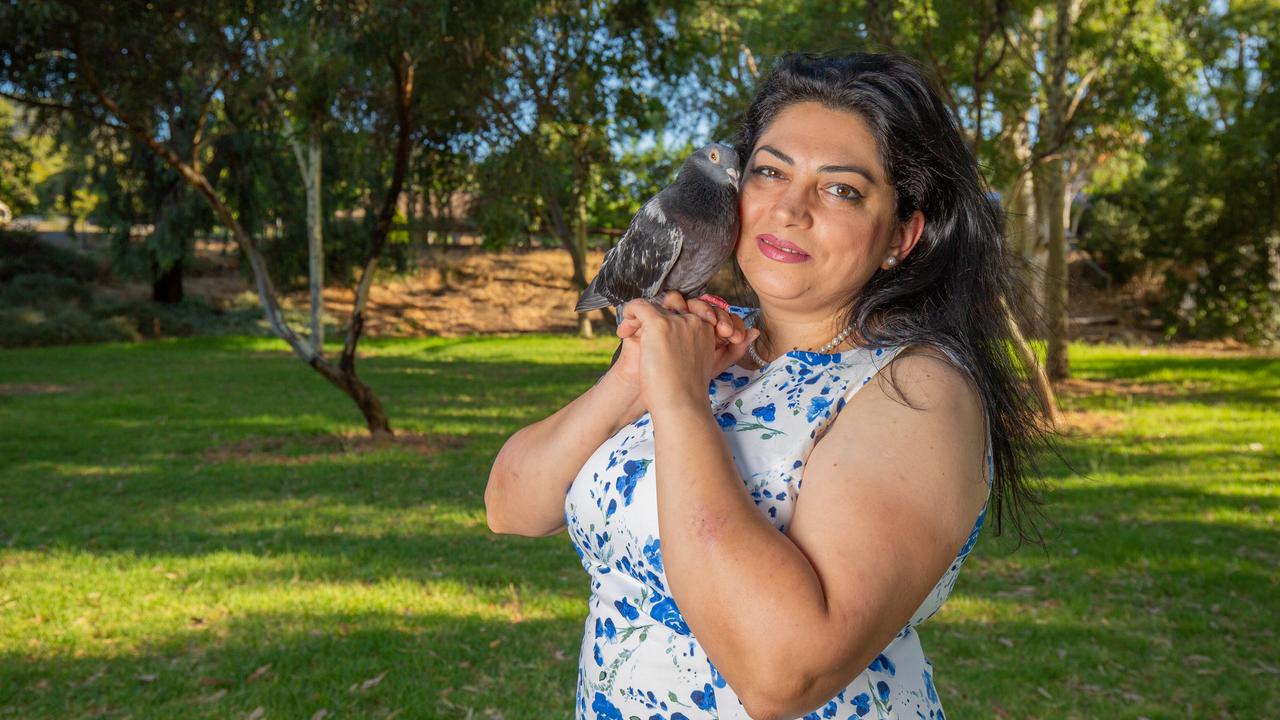 Samira Fateh with one of her pet pigeons from her Athelstone home. Picture: Ben Clark