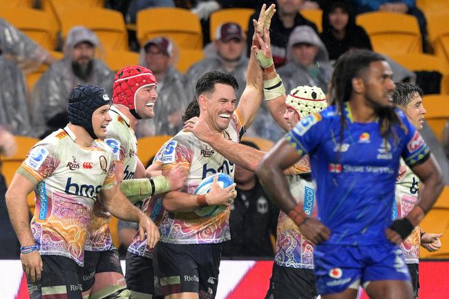 Lachie Anderson of the Reds celebrates with team mates after scoring a try during the round 16 Super Rugby Pacific match between Queensland Reds and Fijian Drua at Suncorp Stadium, on May 31, 2025, in Brisbane, Australia. (Photo by Bradley Kanaris/Getty Images)