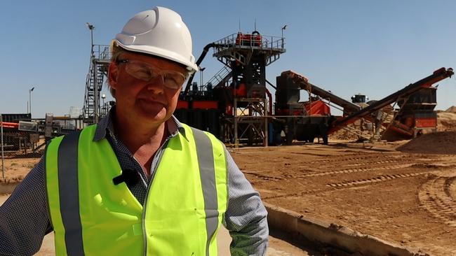 Centrex CEO Robert Mencel stands in front of the phosphate rock processing plants at Ardmore near Mount Isa.