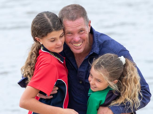 Jason Ross from Ballina, pictured with his daughters Alicia and Layla, helped evacuate victims of the Lismore floods. Picture: Danielle Smith