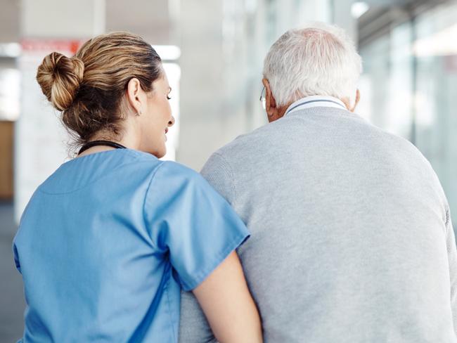 AGED CARE/NURSING HOME/SENIOR/RESIDENTIAL CARE. Picture: istock   Shot of a female nurse assisting her senior patient while walking