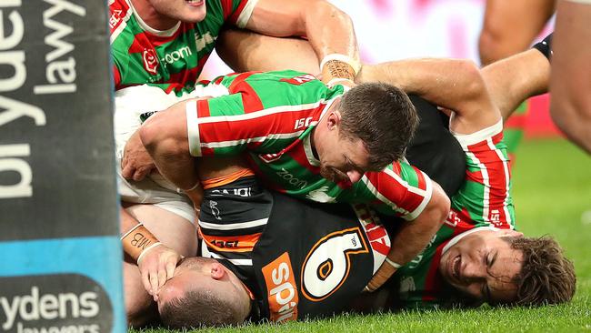 Robbie Farah (9) has his eye gouged by South Sydney prop George Burgess. Picture. Phil Hillyard