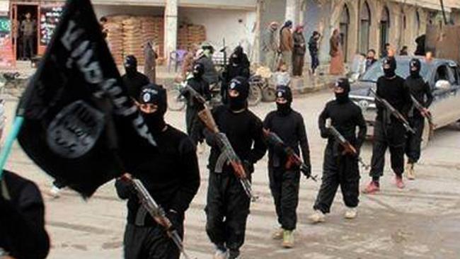 Islamic State militants march through the streets of Raqqa, Syria. Picture: AP/Militant website