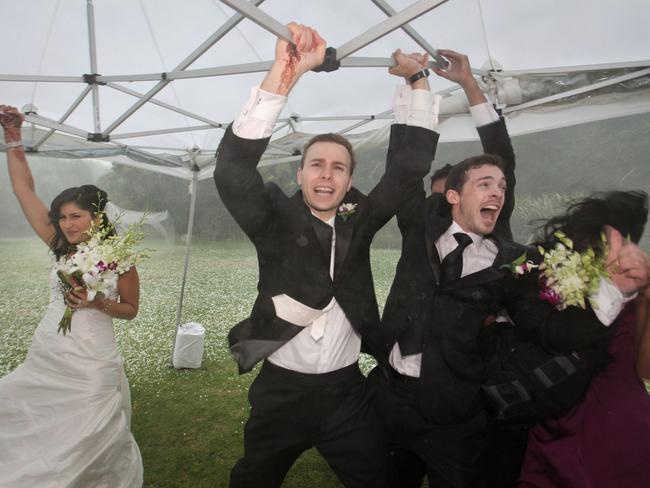 Minutes after Grace and Zeljko Thiara exchanged vows, the couple and their guests fled for safety as a ferocious hailstorm tore Melbourne apart. Picture: Rob Maccoll