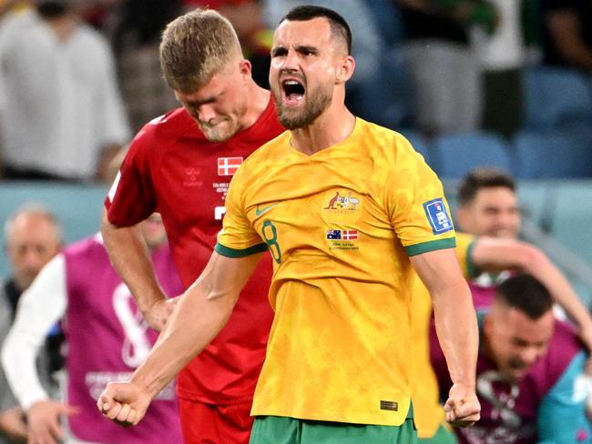 Australian defender Bailey Wright celebrates victory over Denmark, before coming off the pitch to terrible news. Picture: AFP