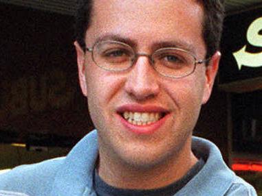 USA formerly overweight obese man Jared Fogle who lost 100 kg in weight after eating Subway sandwiches for one year. Here outside Subway outlet in Sydney holding his old size 61 inch trousers 14 May 2002.