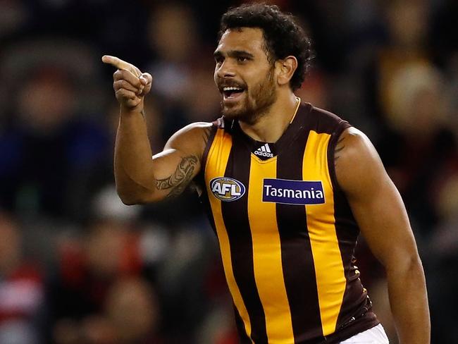 MELBOURNE, AUSTRALIA - JUNE 10: Cyril Rioli of the Hawks celebrates a goal during the 2016 AFL Round 12 match between the Essendon Bombers and the Hawthorn Hawks at Etihad Stadium on June 10, 2016 in Melbourne, Australia. (Photo by Adam Trafford/AFL Media/Getty Images)