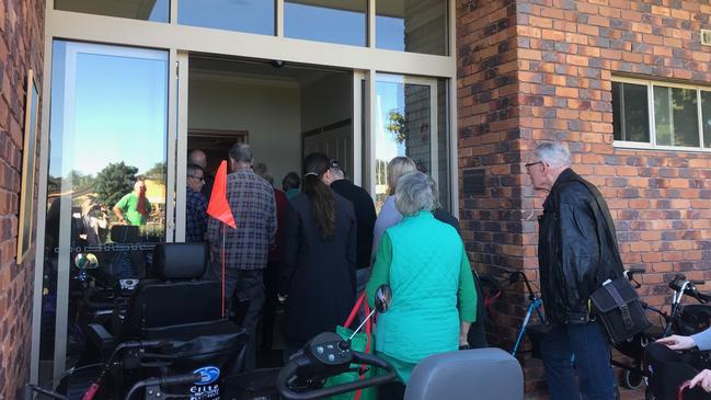 Residents and family from Earle Haven retirement village pack into the auditorium for a meeting about abrupt closure of the nursing home wing.