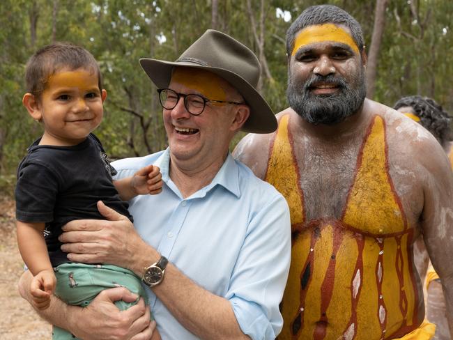 EAST ARNHEM, AUSTRALIA - JULY 29: Australian Prime Minister Anthony Albanese interacts with a child during the Garma Festival at Gulkula on July 29, 2022 in East Arnhem, Australia.  The annual Garma festival is held at Gulkula, a significant ceremonial site for the Yolngu people of northeast Arnhem Land about 40km from Nhulunbuy on the Gove peninsula in East Arnhem. The festival is a celebration of Yolngu culture aimed at sharing culture and knowledge which also brings politicians and Indigenous leaders together to discuss issues facing Australia's Aboriginal and Torres Strait Islander people. This year is the first time the festival has been held since 2019 following a two-year absence due to the COVID-19 pandemic. (Photo by Tamati Smith/Getty Images)