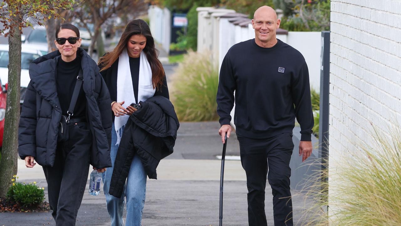 MELBOURNE, AUSTRALIA- July 9 2022, L-R partner, Michelle Owen, daughter Stella and Michael Klim is seen walking with his family while using a walking stick.Picture: Brendan Beckett - ID's Confirmed by Briana Domjen