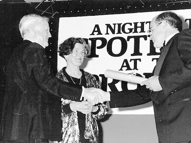 Bern (at left) and Aileen accept a “Brolga” award from Territory Tourism Minister, Hon. Roger Vale MLA, in recognition of their pioneering contribution to tourism industry development.