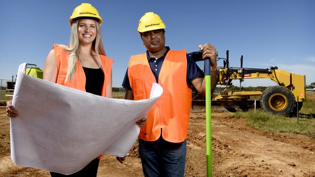 Oceanic Properties managing director Viv Chauhan with Raine &amp; Horne agent Casey De Michele on the site of the new housing project. Picture: Naomi Jellicoe