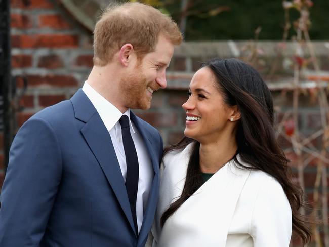 LONDON, ENGLAND - NOVEMBER 27:  Prince Harry and Meghan Markle during an official photocall to announce the engagement of Prince Harry and actress Meghan Markle at The Sunken Gardens at Kensington Palace on November 27, 2017 in London, England.  Prince Harry and Meghan Markle have been a couple officially since November 2016 and are due to marry in Spring 2018.  (Photo by Chris Jackson/Getty Images)