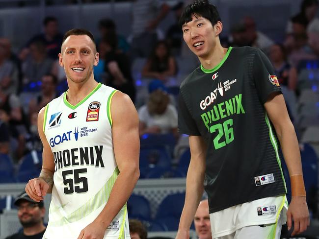 Mitch Creek and Zhou Qi share a laugh during a Phoenix game. Picture: Getty Images