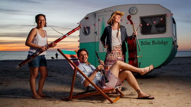 Adelaide Symphony Orchestra musicians Jackie Newcomb (contrabassoon), Dean Newcomb (clarinet) and Gemma Phillips (cello) warm up for its schools show Are We There Yet? at Seacliff. Picture: Matt Turner.