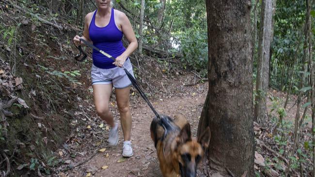 Jacqui Wong walks the Earl Hill Conservation Track with her dog Memphis. The nature conservation park is highly popular since the State Government bought the 54ha property for $4m from developer Consolidated Properties in 2018.