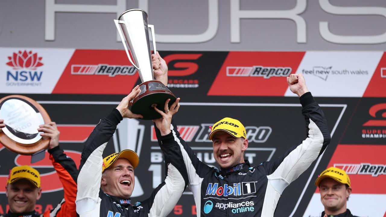 BATHURST, AUSTRALIA – DECEMBER 05: Lee Holdsworth and Chaz Mostert drivers of the #25 Mobil 1 Appliances Online Racing Holden Commodore ZB hold aloft the Peter Brock Trophy after winning the Bathurst 1000 which is part of the 2021 Supercars Championship at Mount Panorama on December 05, 2021 in Bathurst, Australia. (Photo by Brendon Thorne/Getty Images)