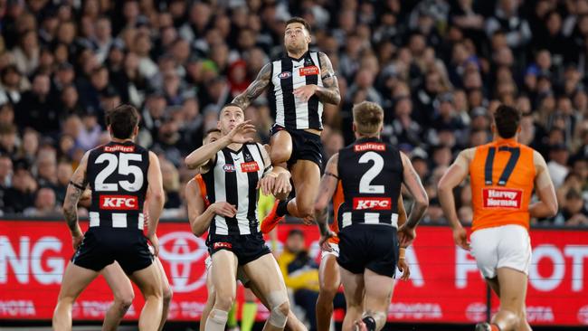 The Collingwood star leaps high during the preliminary final against the Giants. Picture: Dylan Burns/AFL Photos