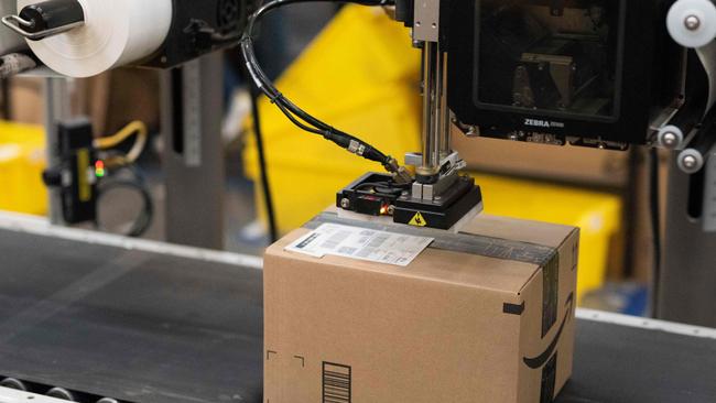 Rapid technological changes have hugely benefited the profit margins of tech giants like Amazon, but seriously damaged employment rates. Picture: Grant Hindsley/AFP