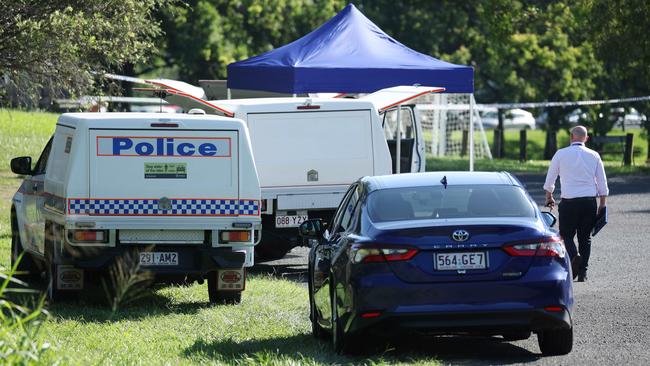 Police investigate the scene where a body was found in a burnt-out car Monday. Picture: Liam Kidston