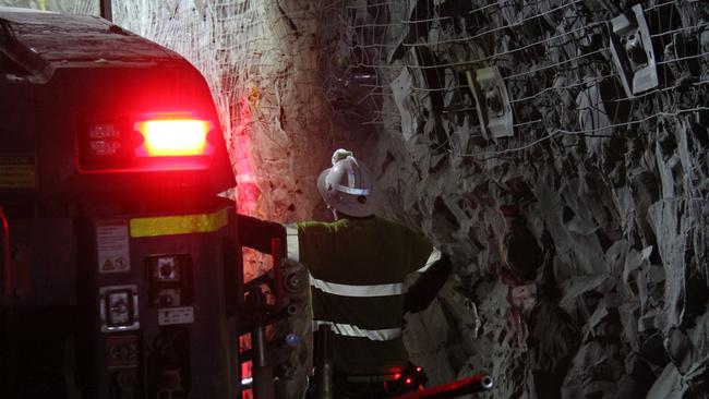 A worker next to a 'bogger' one of the many machines underground in the Dead Bullock Soak. Picture: Gera Kazakov