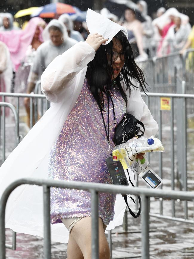 Pictured outside Accor Stadium at Sydney Olympic Park are Taylor Swift fans in the rain ahead of Taylor Swifts first Sydney show on her Eras Tour. Picture: Richard Dobson