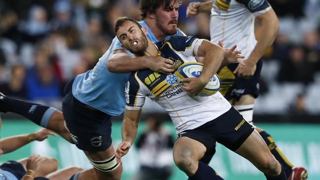 Nic White of ACT if tackled by Kane Douglas of NSW. NSW Waratahs Vs ACT Brumbies Saturday 28th June 2014. Pic: Mitch Cameron