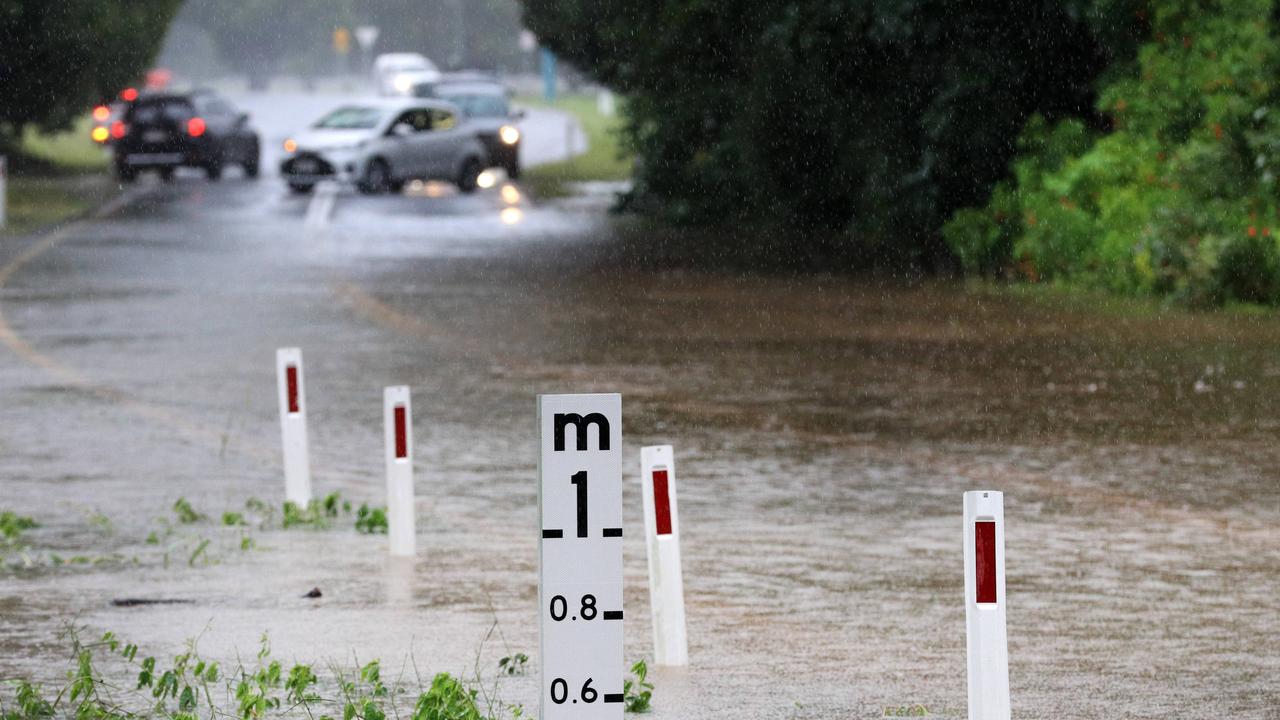 Cars turn around at Tallebudgera Connection Road, Tallebudgera on Tuesday March 23 at the back of Currumbin Creek after torrential rain over night caused the creek to break its banks. Picture: NCA NewsWire / Scott Powick