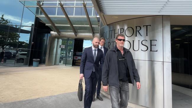 Andrew Douglas Truran leaving Southport Courthouse with his lawyer Farshad Sarabi after pleading guilty to spitting in woman's face. Picture: Charlton Hart