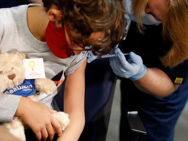 A seven-year-old child receives their first dose of the Pfizer Covid-19 vaccine in Michigan. Picture: AFP