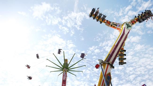 The skychair and March's Skywalker thrill rides in sideshow alley at the Cairns Show. PICTURE: BRENDAN RADKE