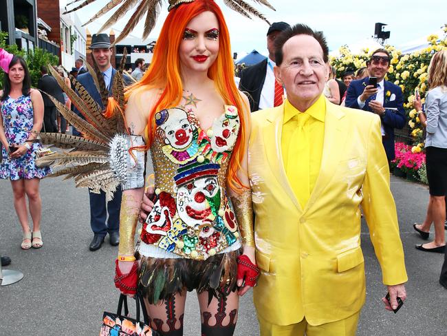 Gabi Grecko with Geoffrey Edelsten after he proposed to her on one knee in the Birdcage at Flemington Racecourse during the Melbourne Cup.