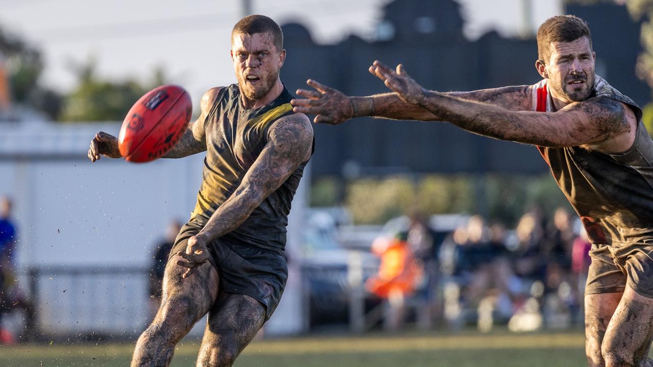 Tom Simpson plying his trade in the mud for Labrador in the QAFL. Picture: Kieron Turner.