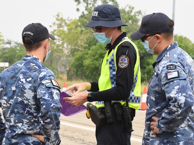 Royal Australian Air Force members assist NT Police at the southern border control checkpoint in Katherine. Picture: Amanda Parkinson