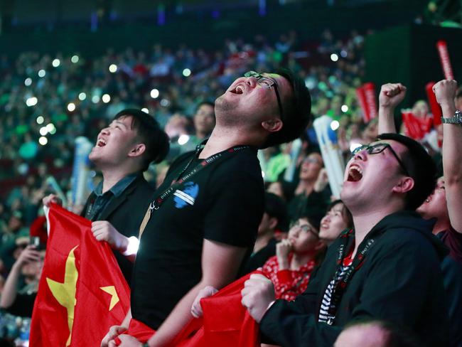 Excited fans react to the gameplay in the stands. Picture: Jeff Vinnick