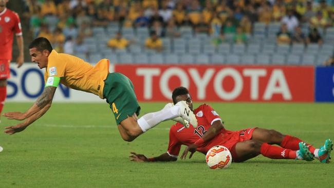 Australia's Tim Cahill is fouled during the Socceroos v Oman Asian Cup game at ANZ Stadium, Sydney Olympic Park. pic Mark Evans