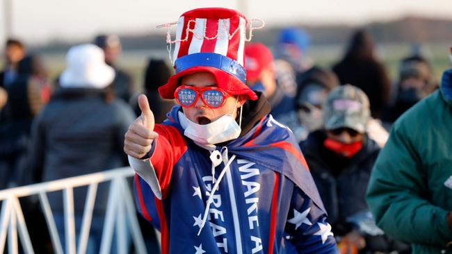 A Trump supporter gestures a thumbs up as at the US President’s final Make America Great Again rally at Gerald R. Ford International Airport on November Monday. Picture: AFP